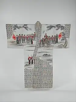 A grey-toned men's kimono depicting soldiers in uniform holding the rising sun flag