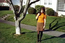 American girl wearing a mini skirt and patterned tights, 1966