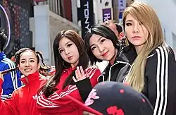 2NE1 onstage, in different poses