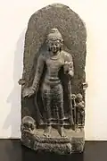 Taming Nalagiri the elephant, who appears at hedgehog size at left, with Ananda at right