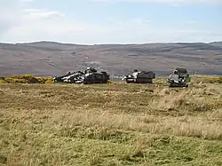 "Shape, shine, shadow" make these 'camouflaged' military vehicles easily visible.