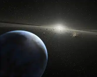 A blue planet, asteroids and a distant star.