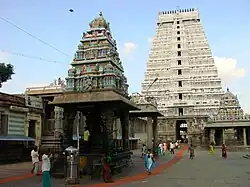 Temple tower with people passing through.