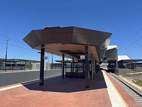 A train station platform with shelter