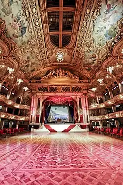 A dance hall seen from the interior looking towards the stage stone