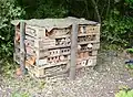 Insect hotel made from wooden pallets, West Grinstead railway station, West Sussex, United Kingdom