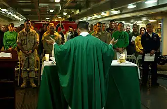 U.S. Navy Chaplain Father Kenneth Medve offers Catholic Mass on board the USS Ronald Reagan.
