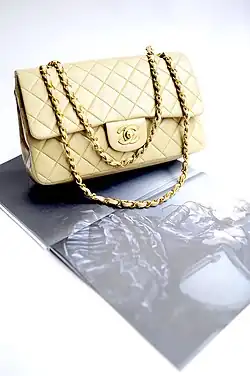 Chanel handbag in quilted-leather with adjustable double-chains to wear on the arm or shoulder.