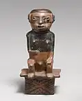 Male figure-shaped coca chewer on bench; 9th–15th century; ceramic; height: 21.6&nbsp;cm (81⁄2 in.), width: 10.2&nbsp;cm (4 in.); Metropolitan Museum of Art