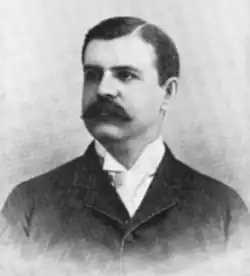 McCormick glancing away from a camera