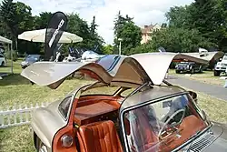 Interior of a coupé, with room for only one suitcase