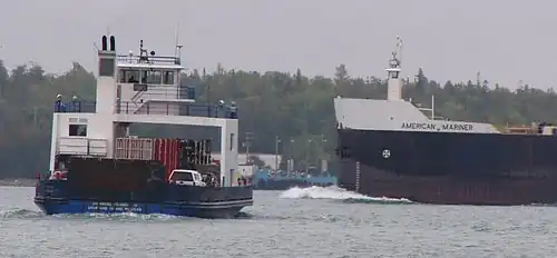The SS Drummond Islander IV crossing the De Tour Passage near the SS American Mariner