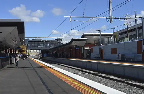 Footscray station Platform 2 looking west, showing the station concourse and footbridge