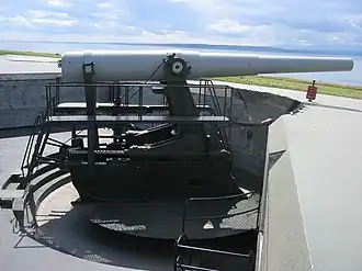 A canon in an embarkment overlooking water