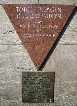 Triangle of pink stone with dark bronze square of text