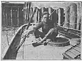 Gerbault at the aft deck with his hand on the tiller