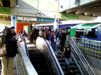 Passengers exit a northbound Metrorail train during rush hour