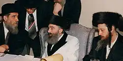 The present Zvhil-Mezhbizh Rebbe, Grand Rabbi Yitzhak Aharon Korff of Boston, Center, with cousins the late Tolner Rebbe (left), Rabbi Yitzhak Twersky of Boston, and the Grand Rabbi Shlomo Goldman, Zvhiller Rebbe of Union City