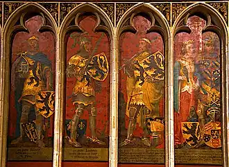 A series of four paintings in an elaborate frame