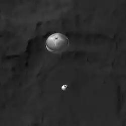 Curiosity descending under its parachute, as viewed by HiRISE (MRO) (August 6, 2012)