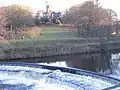 In the middle of this weir is a fish ladder, which allows trout and salmon to pass the weir to go upriver to spawn.