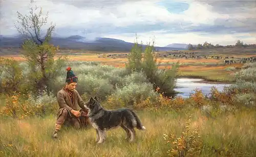 Sami boy playing with his dog