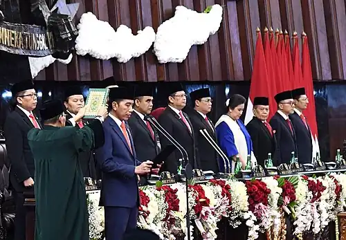 Indonesian president Joko Widodo and leaders of parliament wearing peci as part of national formal attire