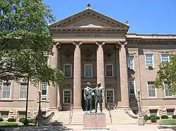 Bronze statue of two standing men