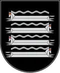 A coat of arms depicting four grey horses with red eyes galloping both to the left and to the right all on a black background
