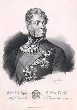 Black and white print shows a man with long sideburns wearing a dark military uniform pinned with several awards.