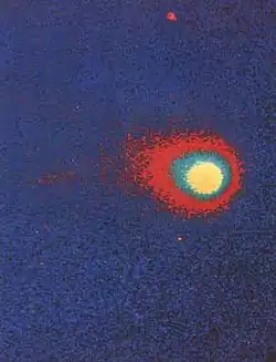 False-color image of the comet, which appears as a bright object at center-right