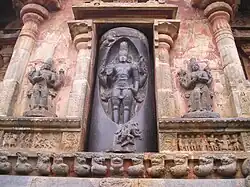 Sculpture of a lingam with Shiva emanating out of it with Vishnu on the right and Brahma on the left