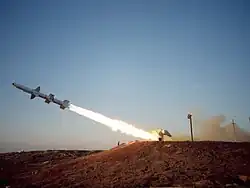 Missile firing, it is taking off at about a 30 degree angle with flames coming out the back