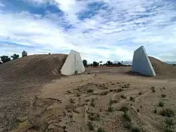 Ammo Bunker (S-1007), SW of Vosler Dr. (formerly Alaska Dr.), at Arizona State University at the Polytechnic campus (formerly Williams AFB). Built in 1942 by the Del E. Webb Construction Company. Listed in the National Register of Historic Places ref: 95000748.