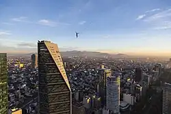 Schulz crossing Reforma on a highline above Mexico City
