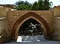 The ancient archaeological gate leading to the three monastery churches (without the fortress).