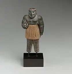 Monstrous male figure; late 3rd–early 2nd millennium BC; chlorite, calcite, gold, and iron; height: 10.1&nbsp;cm; Metropolitan Museum of Art