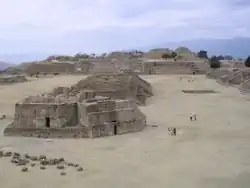 some ancient stone ruins of buildings in a sandy area