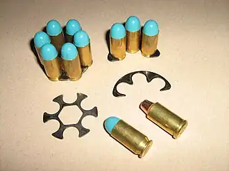Full and half moon clips loaded with .45 ACP and one Truncated Cone .45 Auto Rim cartridge.