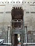 The entrance portal of the mosque, with its flat muqarnas canopy