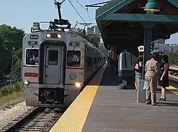 A southbound NICTD South Shore train entering the 55th/56th/57th station in the Hyde Park neighborhood of Chicago in 2006