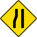 Road narrows on left