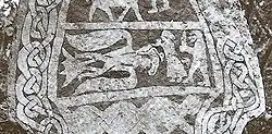 The Gotlandic image stone Hammars (III). It is held to depict Odin in his eagle fetch (note the eagle's beard), Gunnlöð (holding the mead of poetry) and Suttungr.