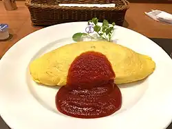 Omurice (Japanese omelette rice) with fried rice inside
