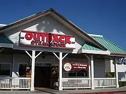 An Out West (Then T-Bird) owned Outback location at Del Amo Fashion Center in Torrance, California, in September 2007. This location was moved to the outdoor wing, with the original restaurant demolished and turned into a Marshalls location. . Opened in 1994 as the first Outback Steakhouse in Southern California.
