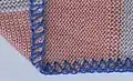 3-thread, 1⁄4&nbsp;in (6.4&nbsp;mm) wide, 7 stitches per inch (3.6&nbsp;mm stitch pitch)
