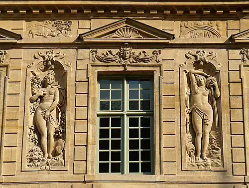 Allegorical bas-reliefs by Jean Goujon ; on the left, Fall, on the right, Winter.