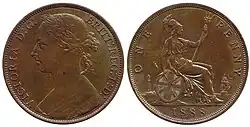 One sides of a bronze penny showing a woman with her hair in a bun