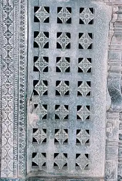 A pierced window screen brings light into the mantapa at Manikesvara Temple