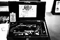 Late model English duelling pistols fired by percussion cap, bearing the Royal Warrant on the case